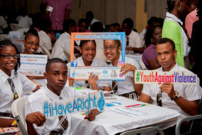 group of students holding placards and frames