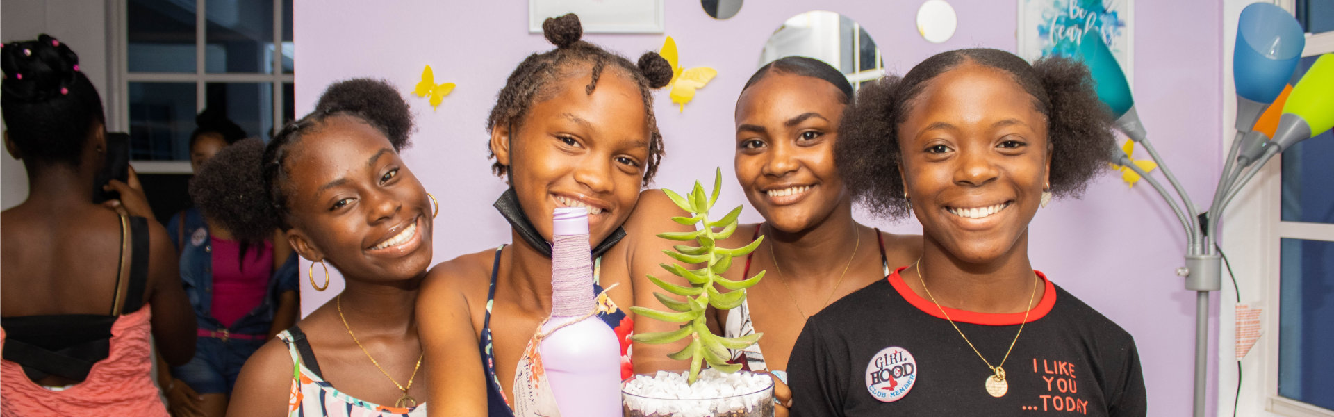 group of girls smiling on camera